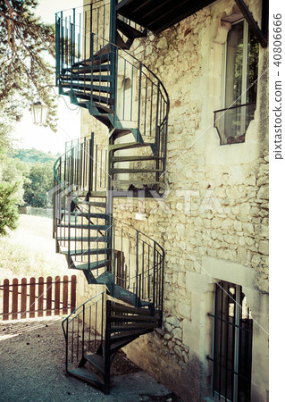 Very old outdoor spiral staircase 40806666