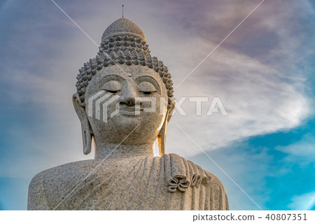 Low angle view of white marble big Buddha statue Low angle view of white marble big Buddha statue 40807351