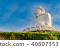 Low angle view of white marble big Buddha statue 40807353