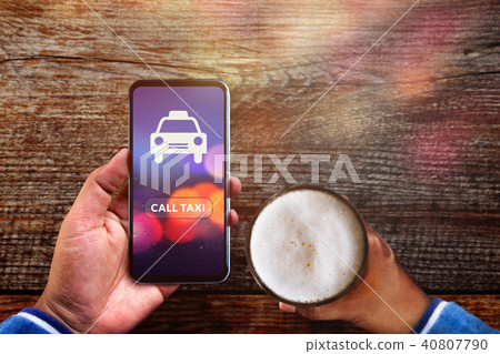 Call Taxi Application. Drunker using Smartphone Call Taxi Application. Drunker using Smartphone 40807790