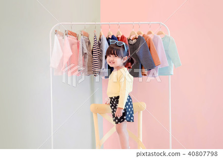 Soft Focus of a Two Years Old Child choosing dress 40807798