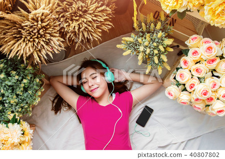 Happy Young Woman Laying on Floor,Listening Music Happy Young Woman Laying on Floor,Listening Music 40807802