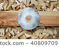 Carpenter tools on wooden table with sawdust. Circular Saw. Cutting a wooden plank 40809709