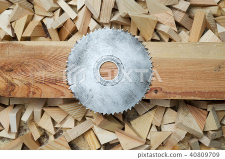Carpenter tools on wooden table with sawdust. Circular Saw. Cutting a wooden plank 40809709