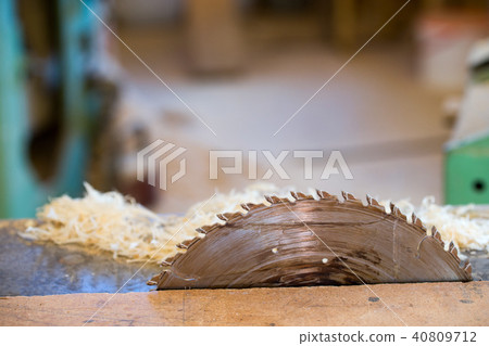 Carpenter tools on wooden table with sawdust. Circular Saw. Cutting a wooden plank Carpenter tools on wooden table with sawdust. Circular Saw. Cutting a wooden plank 40809712