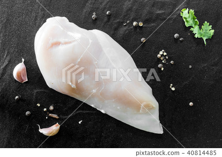 Raw chicken breasts with pepper and garlic Raw chicken breasts with pepper and garlic 40814485