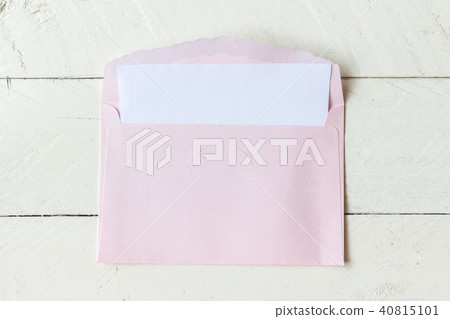 A envelope on wooden background A envelope on wooden background 40815101