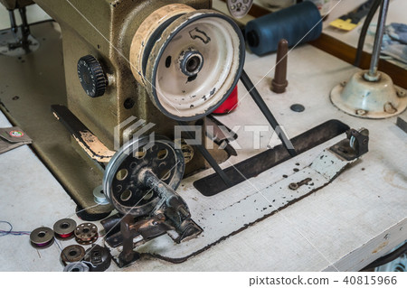 Close up of old sewing machine bobbins Close up of old sewing machine bobbins 40815966