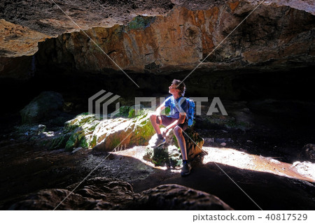 A man sitting in the Caves Of Salamanca, Uruguay A man sitting in the Caves Of Salamanca, Uruguay 40817529