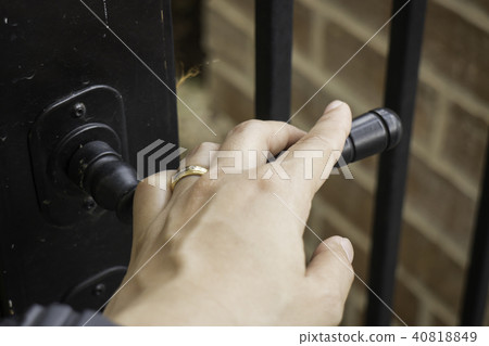 Woman hand hold on opening door Woman hand hold on opening door 40818849