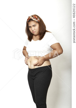 Asian Woman measuring fat 40820122