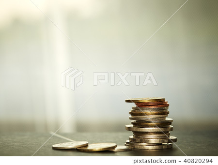 Coins stacked on each other in different 40820294