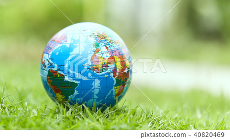 Globe lies on green grass 40820469