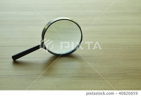 magnifying glass over the table 40820859