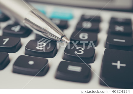Calculator and pen. Finance and money investment 40824134