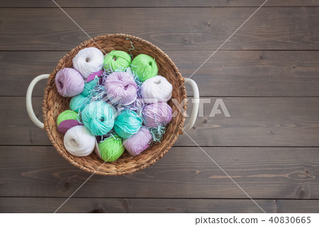 Colorful balls of wool and cotton yarn in a basket 40830665