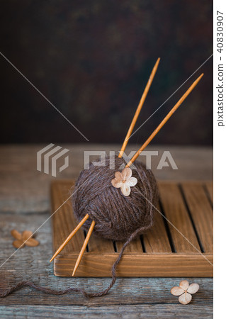 Wool yarn with wooden needles on rustic, wabi sabi 40830907