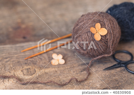 Wool yarn with wooden needles on rustic, wabi sabi 40830908