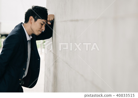 A depressed young businessman A depressed young businessman 40833515