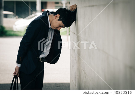 A depressed young businessman A depressed young businessman 40833516