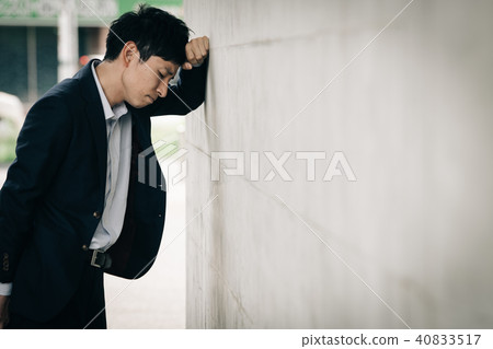 A depressed young businessman 40833517