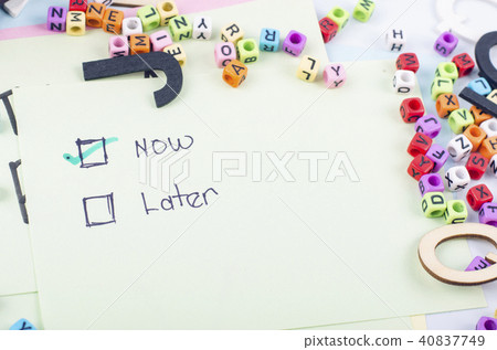 sticky paper with handwriting word LATER and NOW 40837749