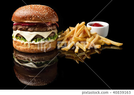 Craft beef burger and french fries, sauce isolated on black background. Craft beef burger and french fries, sauce isolated on black background. 40839163