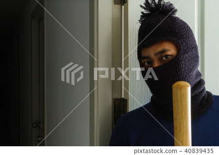 Masked robber with baseball bat  Masked robber with baseball bat  40839435