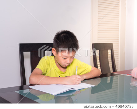 Asia little student boy studying doing homework 40840753