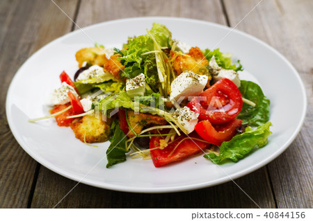 Vegetable salad with letuce, croutons, feta cheese Vegetable salad with letuce, croutons, feta cheese 40844156