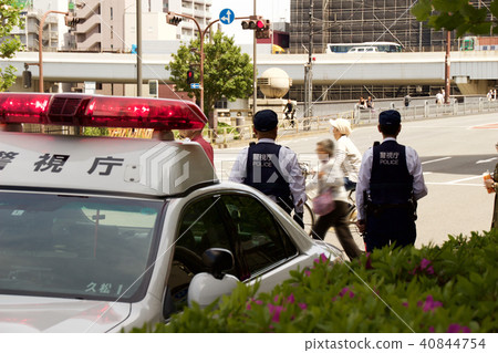 Cops watching pedestrians Cops watching pedestrians 40844754