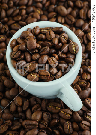 Grains of coffee in a cup. Grains of coffee in a cup. 40845463