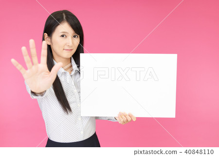 A woman who makes a stop gesture A woman who makes a stop gesture 40848110