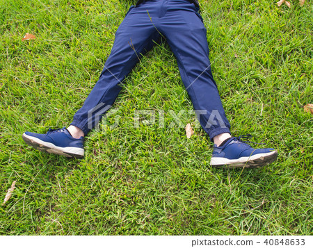lying on the grass 40848633