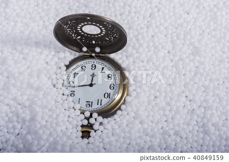 Pocket watch on white polystyrene foam balls Pocket watch on white polystyrene foam balls 40849159