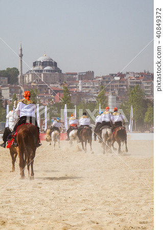 Horseman riding in their ethnic clothes on horse 40849372