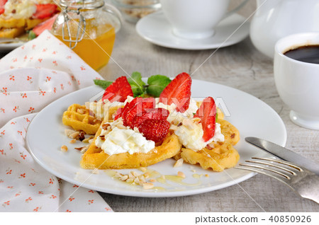 Belgian waffles with whipped cream   strawberries 40850926