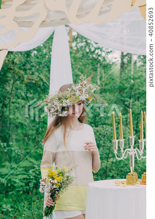 Beautiful woman with a wreath on her head from 40852693