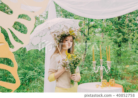 Beautiful woman with a wreath on her head from 40852758