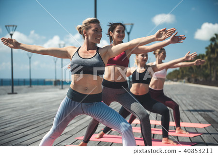 Cheerful females doing physical exercises 40853211