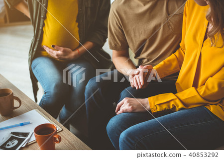 Cheerful future parents waiting for surrogacy baby Cheerful future parents waiting for surrogacy baby 40853292