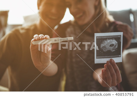 Joyful pregnant woman telling her husband good news Joyful pregnant woman telling her husband good news 40853791