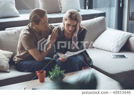 Upset couple worrying about female pregnancy Upset couple worrying about female pregnancy 40853846