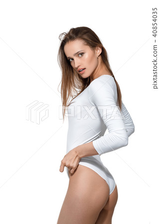 beautiful sexy woman with perfect body in white bodysuit beautiful sexy woman with perfect body in white bodysuit 40854035