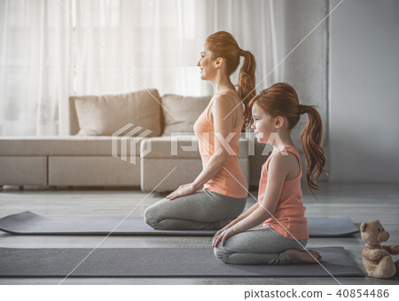 Mom and child are getting ready to workout at home Mom and child are getting ready to workout at home 40854486