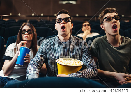 Surprised people in 3d glasses watching movie 40854535