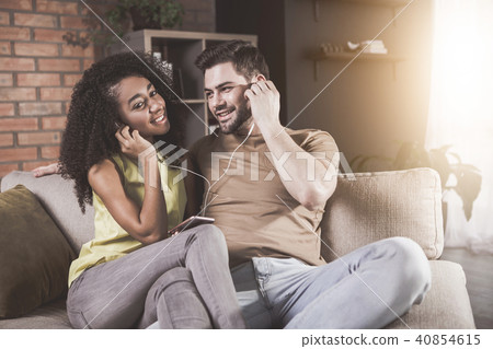 Positive wife and husband are enjoying favorite melody