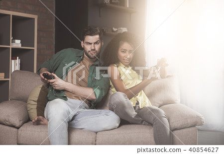 Serious girlfriend and boyfriend are enjoying xbox Serious girlfriend and boyfriend are enjoying xbox 40854627