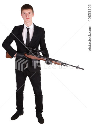 Man in suit with sniper rifle Man in suit with sniper rifle 40855303