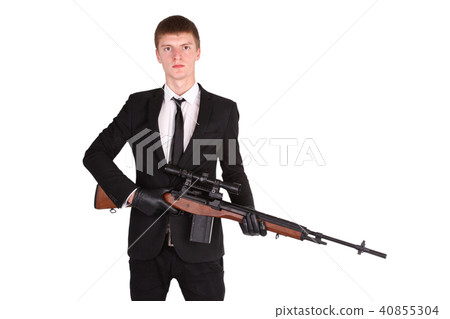 Man in suit with sniper rifle Man in suit with sniper rifle 40855304